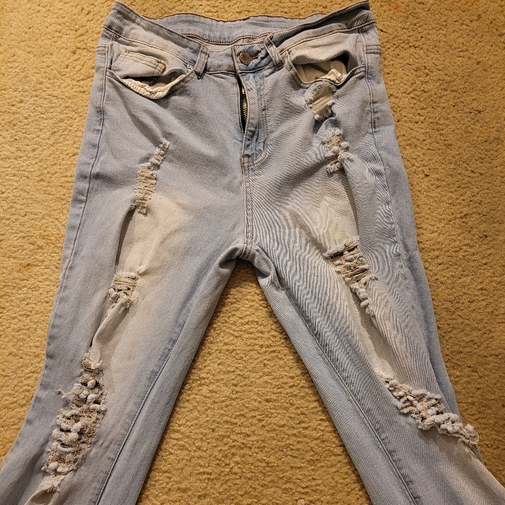 Mid rise light wash distressed jeans